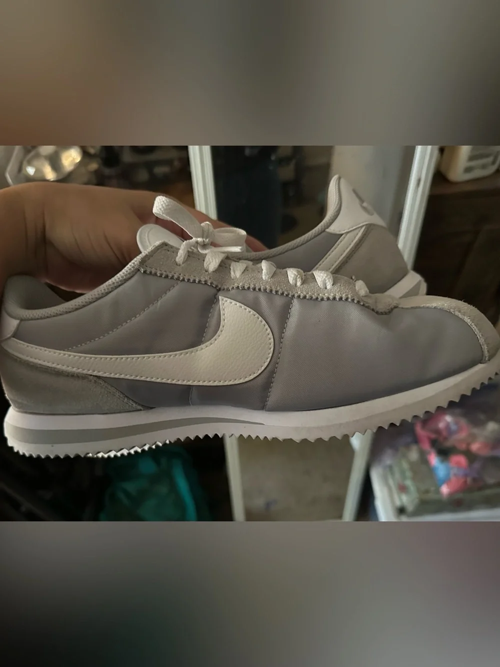Woman’s gray Nike Cortez basic nylon